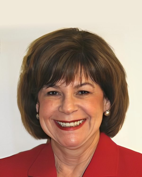 Smiling woman in a red blazer.
