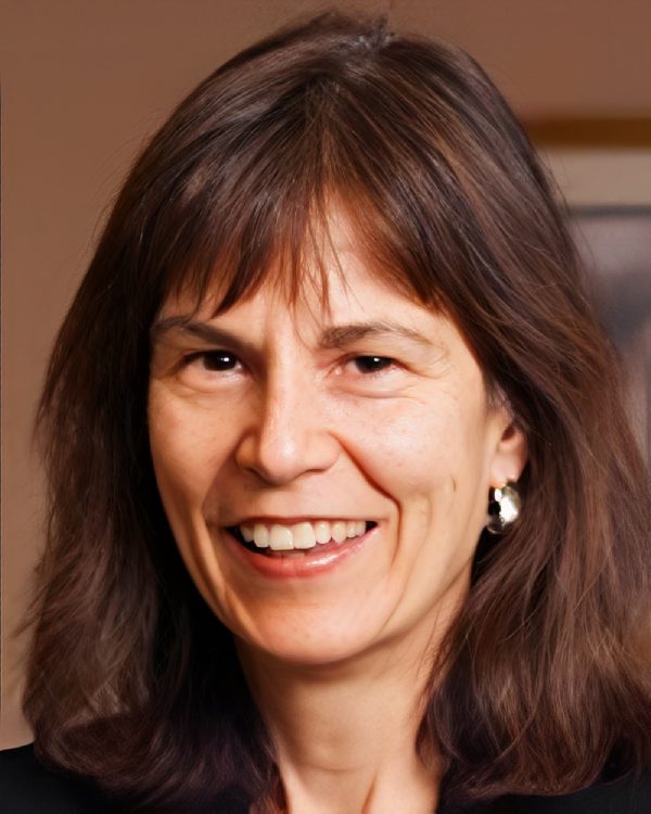 Smiling woman with long brown hair.