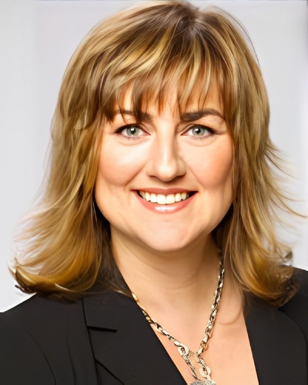 Smiling woman with shoulder-length blonde hair.